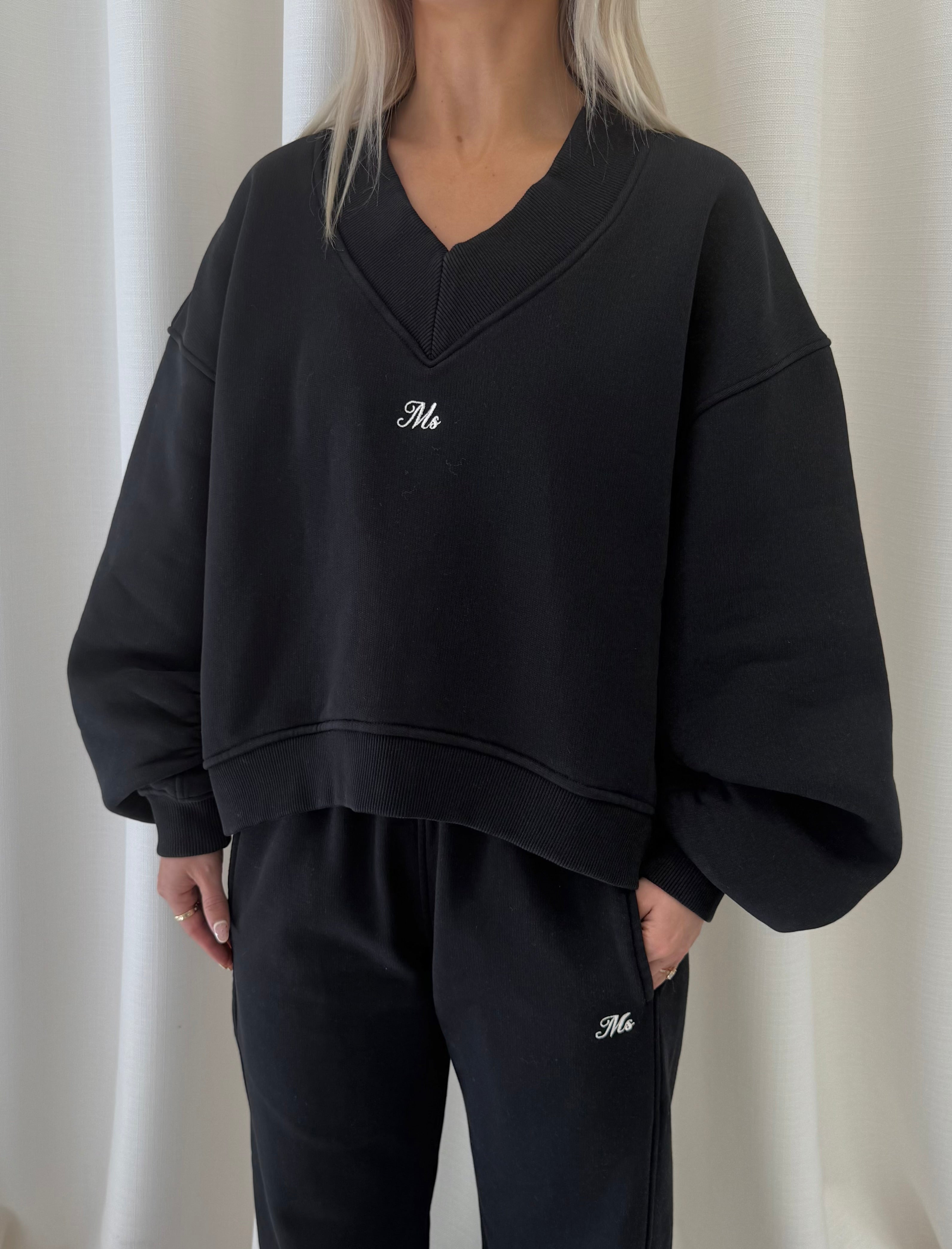 Black V Neck Sweatshirt.