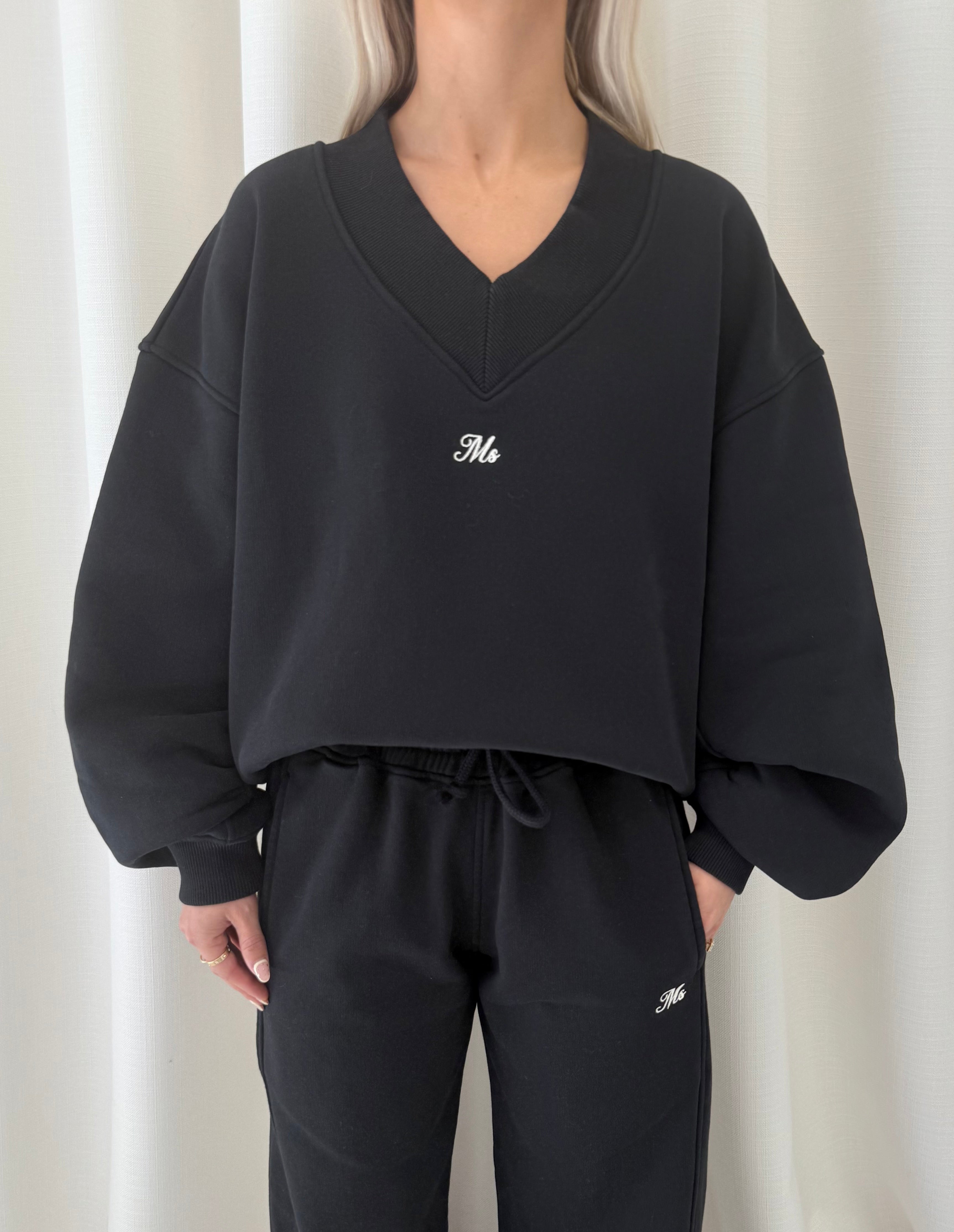 Black V Neck Sweatshirt.