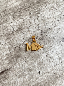 Gold Flaming M pendant.